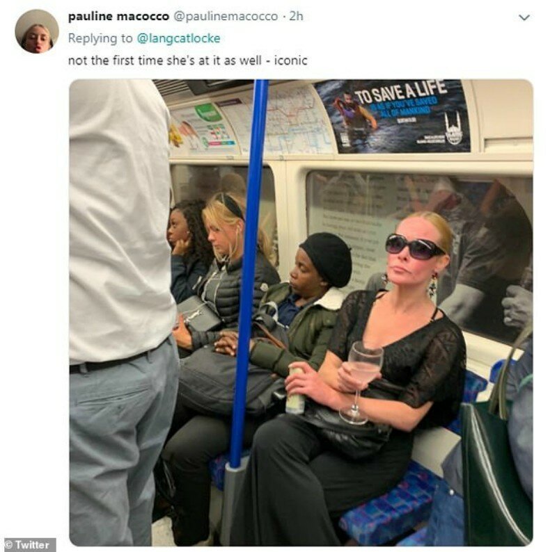 В метро Лондона заметили элегантную даму с бокалом (8 фото)